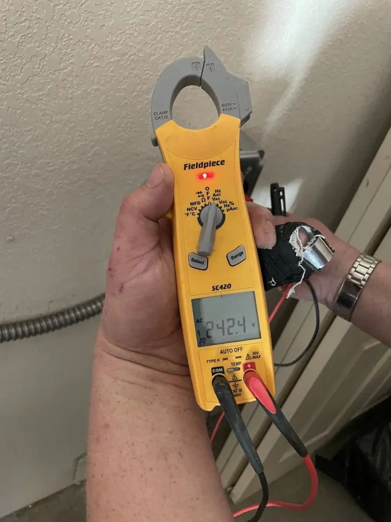 Voltage testing with clamp meter during Circuit Breaker Repair in Manville